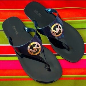 Black MK jelly flip flops